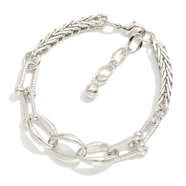 Spiga Chain Link Bracelet Featuring Oval & U Links 

- Gold Dipped 
- Approximately 3" D
- Extender 1" L
