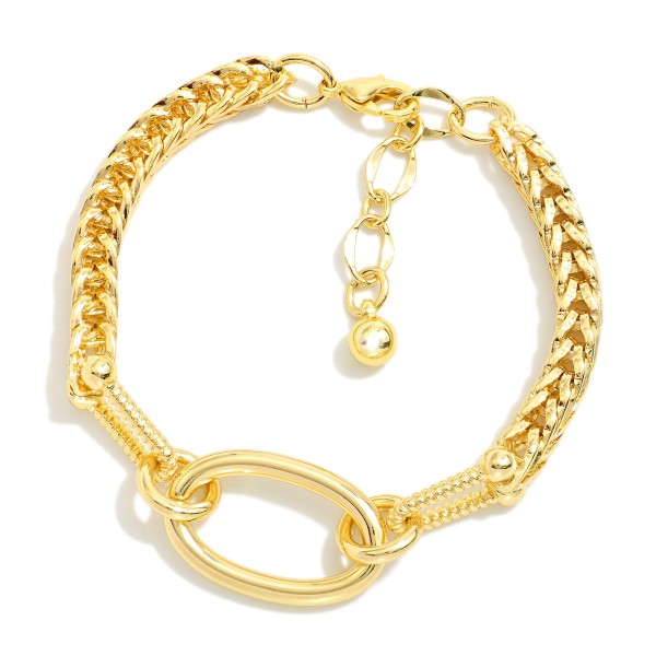 Metal Tone Bracelet With Braided Chain Design Featuring Oval Link and Textured Clasp 

- Gold Dipped
- Approximately 3" L
- Extender 1" L