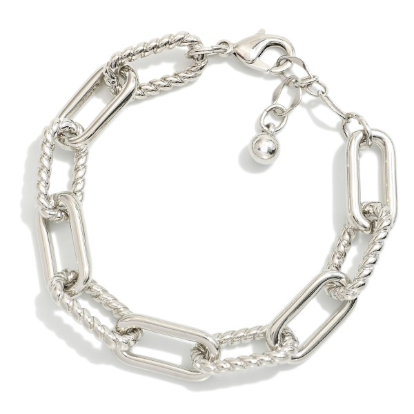 Paperclip Chain Link Bracelet Featuring Twisted Metal Links

- Gold Dipped
- Approximately 3" D
- Extender 1" L