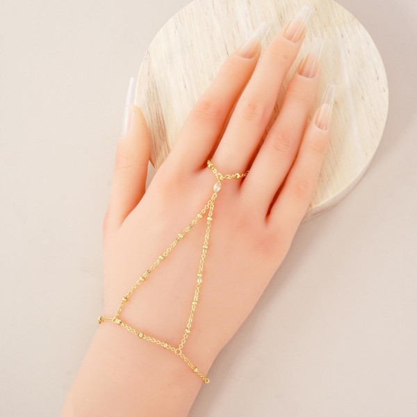 Chain Link Hand Chain Bracelet Featuring Glass Crystal & Metal Bead Stations 

- Gold Dipped 
- Approximately 3" D
