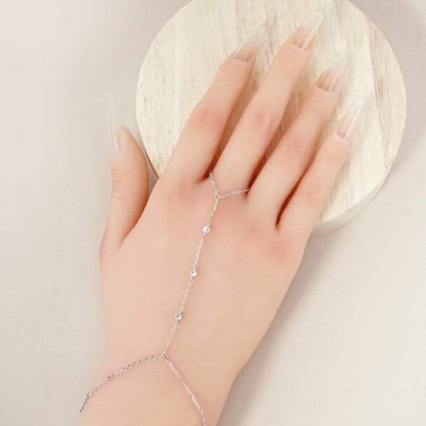 Chain Link Hand Chain Bracelet Featuring Rhinestone Stations 

- Gold Dipped 
- Approximately 3" D
