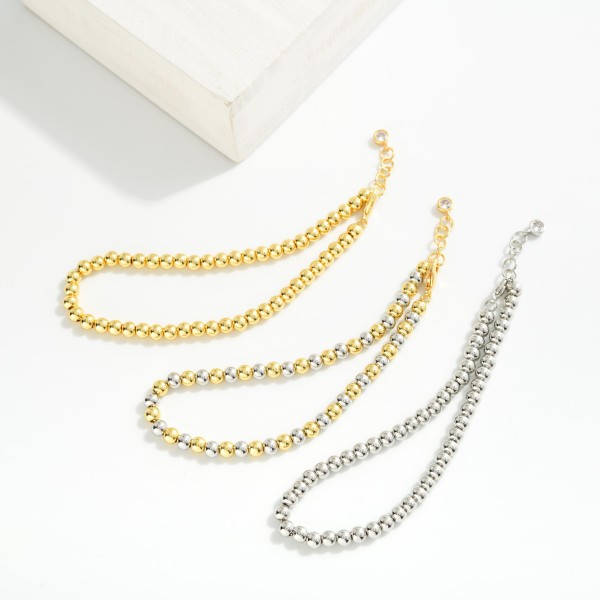 Metal Tone Beaded Bracelet 

- Gold Dipped
- Approximately 3" L
- Extender 1" L