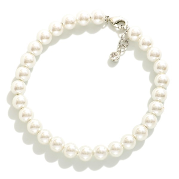 Pearl Beaded Bracelet

- Gold Dipped
- Approximately 3" L
- Extender 1" L