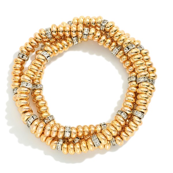 Set Of Three Metal Tone Disk Bead Stretch Bracelets Featuring Rhinestone Details 

- Approximately 2.5" D 

