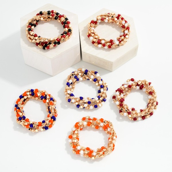 Set Of Five Metal Tone Squared Beaded Stretch Bracelets Featuring Glass Crystal Beads

- Approximately 2.5" D

