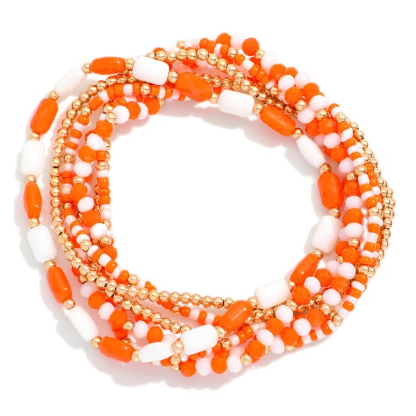 Set Of Seven Metal Tone Mix Beaded Stretch Bracelet Featuring Gold Tones 

- Approximately 3" L