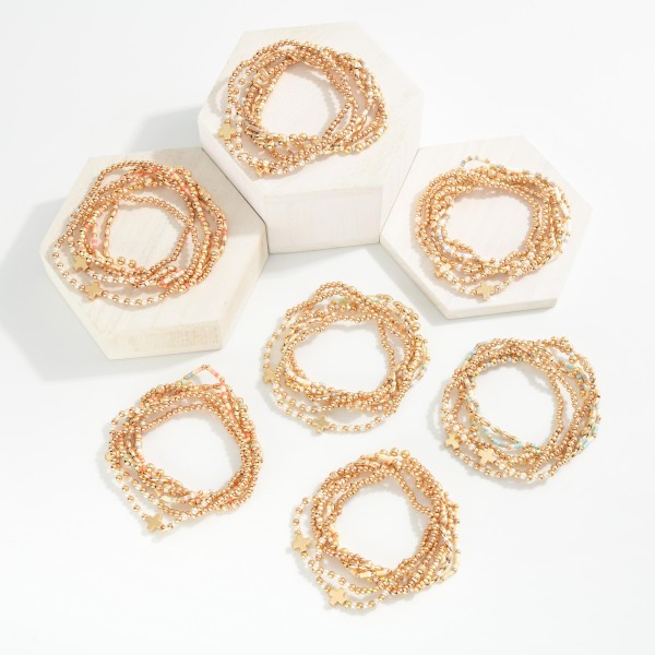 Set Of Six Beaded Stretch Bracelets Featuring Metal Tones, Heishi Beads, & Plus Crosses 

- Approximately 2.5" D