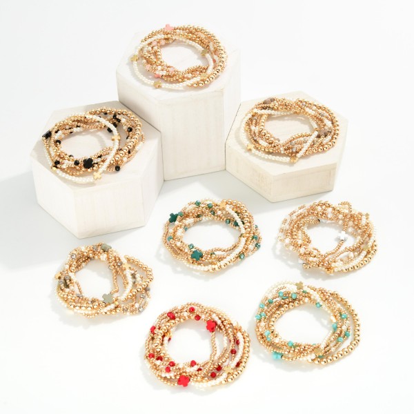 Set Of Seven Gold Tone Beaded Bracelet Featuring Criss Cross Bead And Pearls 

- Approximately 2.5" D 