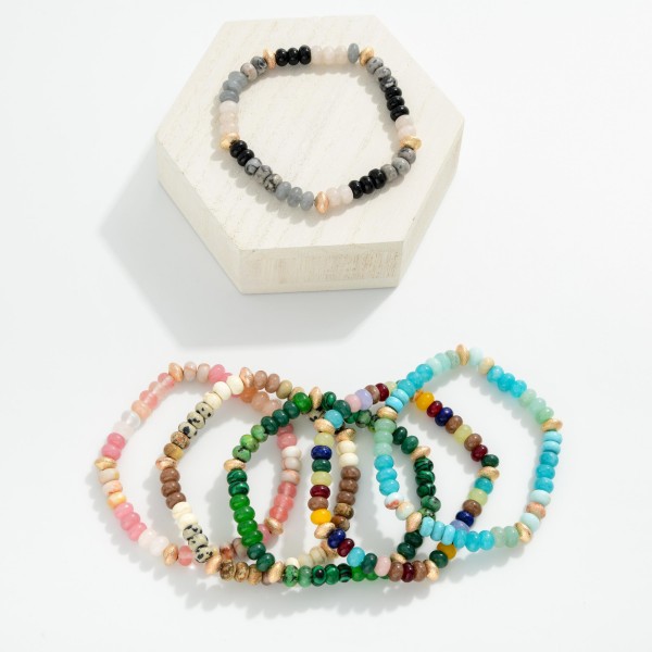 Stone Beaded Stretch Bracelet Featuring Gold Tone Textured Beaded Stations

- Approximately 2.25" D

