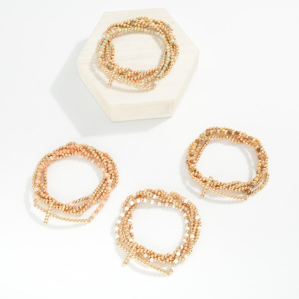 Set Of Five Beaded Stretch Bracelets Featuring Stone, Metal Tones, & Bubble East West Cross 

- Approximately 2.5" D