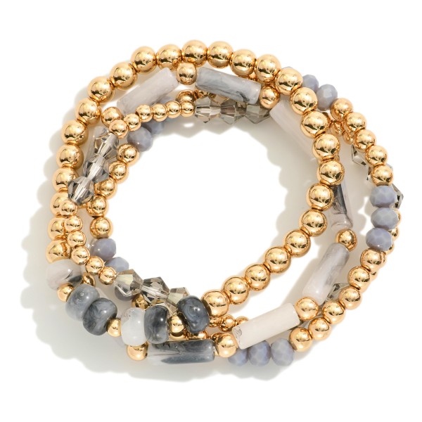 Set Of Four Beaded Stretch Bracelets Featuring Stone Beads And Gold Tones 

- Approximately 2.75 "D 
