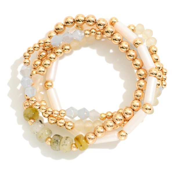 Set Of Four Beaded Stretch Bracelets Featuring Stone Beads And Gold Tones 

- Approximately 2.75 "D 