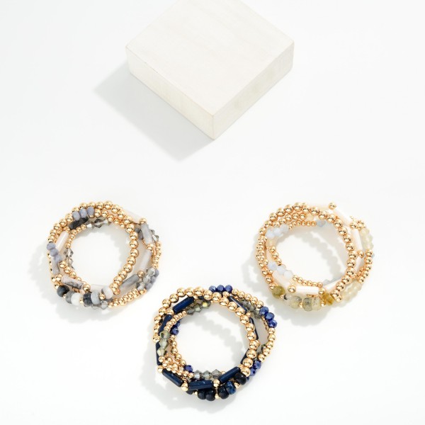 Set Of Four Beaded Stretch Bracelets Featuring Stone Beads And Gold Tones 
- Approximately 2.75 "D