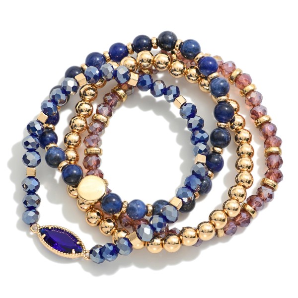 Set Of Four Beaded Stretch Bracelets Featuring Stone Beads & Gold Tones 

- Approximately 3" D 