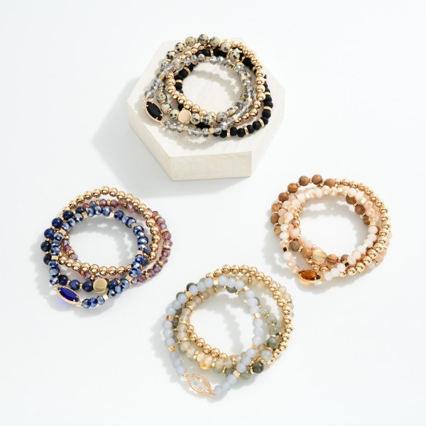 Set Of Four Beaded Stretch Bracelets Featuring Stone Beads & Gold Tones 

- Approximately 3" D 