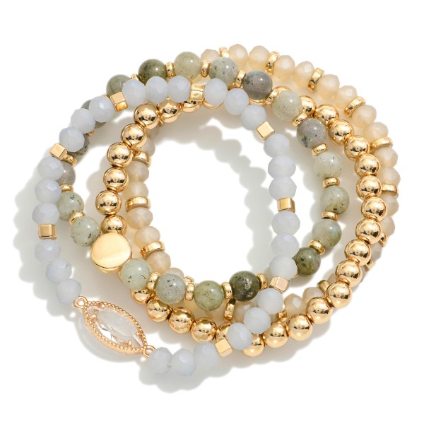 Set Of Four Beaded Stretch Bracelets Featuring Stone Beads & Gold Tones 

- Approximately 3" D 