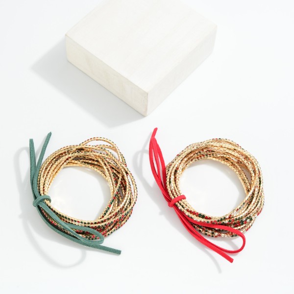 Set Of 12 Rhinestone Beaded Stretch Bracelets With Vegan Leather Bow Detail 

- Approximately 2.5" D