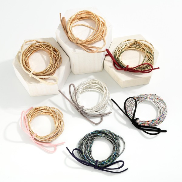 Set Of 12 Rhinestone Beaded Stretch Bracelets With Vegan Leather Bow Detail 

- Approximately 2.5" D