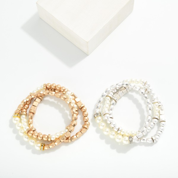 Set Of Three Metal Tone Bead Stretch Bracelets Featuring Pearls 

- Approximately 2.5" D

