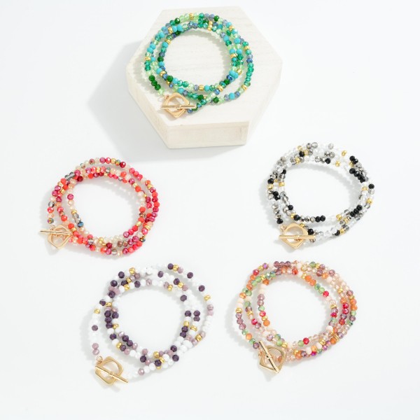 Set Of Three Beaded Stretch Bracelet Featuring Faceted Beads & Gold Metal Tone Stations 
- Approximately 3" D