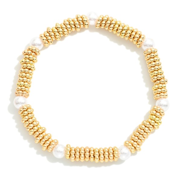 Metal Tone Ridded Disc Stretch Bracelet Featuring Peal Stations

- Approximately 2.5" D  