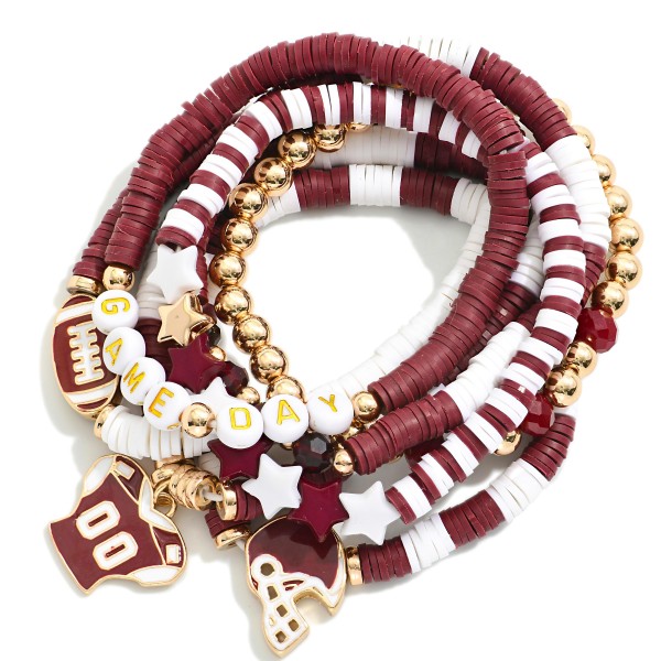 Set Of Seven "Game Day" Heishi Beaded Bracelet Featuring Charms, Gold Tones, And Faceted Beads 

- Approximately 3.5" D 