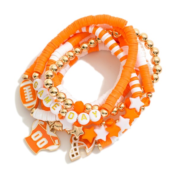 Set Of Seven "Game Day" Heishi Beaded Bracelet Featuring Charms, Gold Tones, And Faceted Beads 

- Approximately 3.5" D 