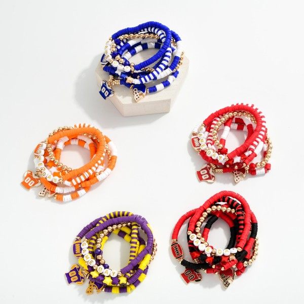 Set Of Seven "Game Day" Heishi Beaded Bracelet Featuring Charms, Gold Tones, And Faceted Beads 

- Approximately 3.5" D 