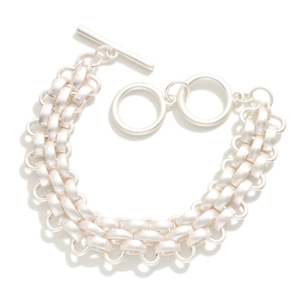 Woven Metal Tone Bracelet With Toggle Clasp 

- Approximately 3" L 