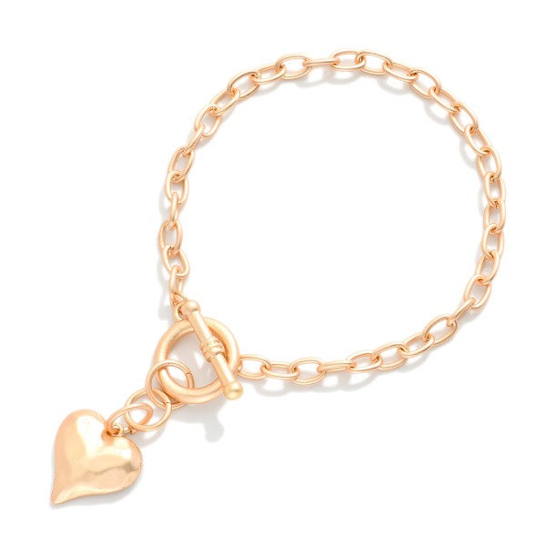 Chain Link Toggle Clasp Bracelet Featuring Hammered Metal Heart Pendant 

- Approximately 2.5" D