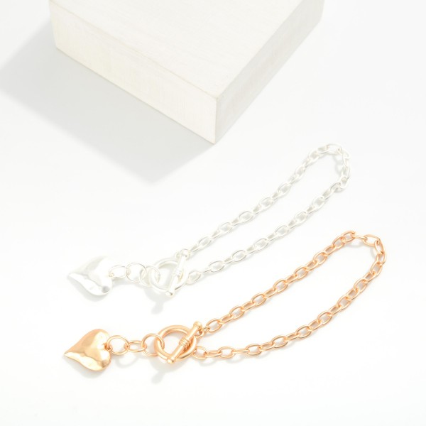 Chain Link Toggle Clasp Bracelet Featuring Hammered Metal Heart Pendant 

- Approximately 2.5" D
