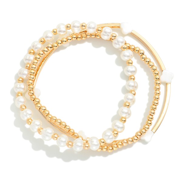 Set Of Three Beaded Stretch Bracelets Featuring Metal Tones, Clovers, & Pearls 

- Approximately 2.5" D