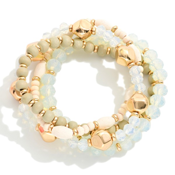 Set Of Four Beaded Stretch Bracelets Featuring Wood Beads, Faceted Beads & Gold Tones

- Approximately 2.25" D