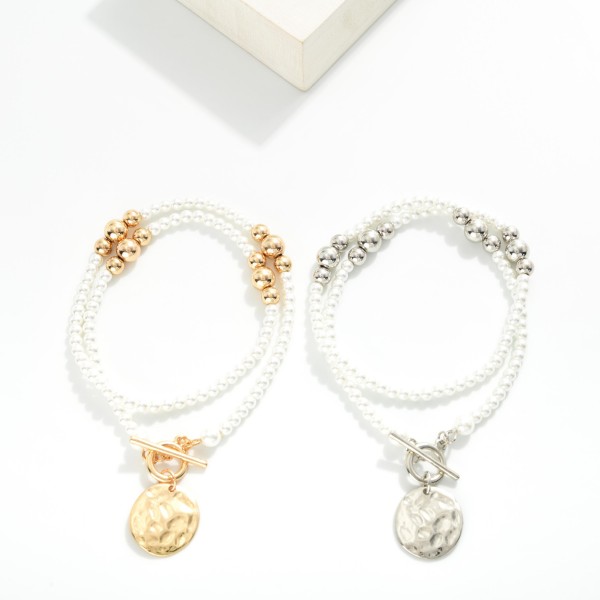 Pearl & Metal Tone Bead Beaded Necklace Featuring Toggle Clasp & Hammered Metal Circle Pendant

- Approximately 18" L
