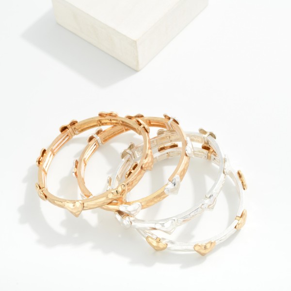 Metal Tone Bangle Stretch Bracelet Featuring Heart Stations 

- Approximately 3" D 