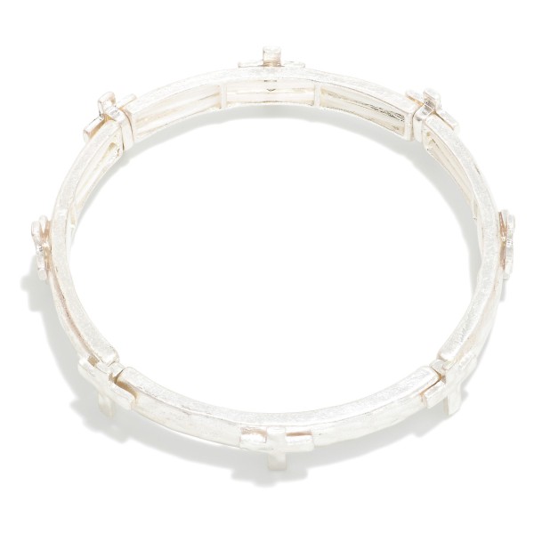 Metal Tone Stretch Bangle Bracelet Featuring Cross Station 

- Approximately 2.75" D 