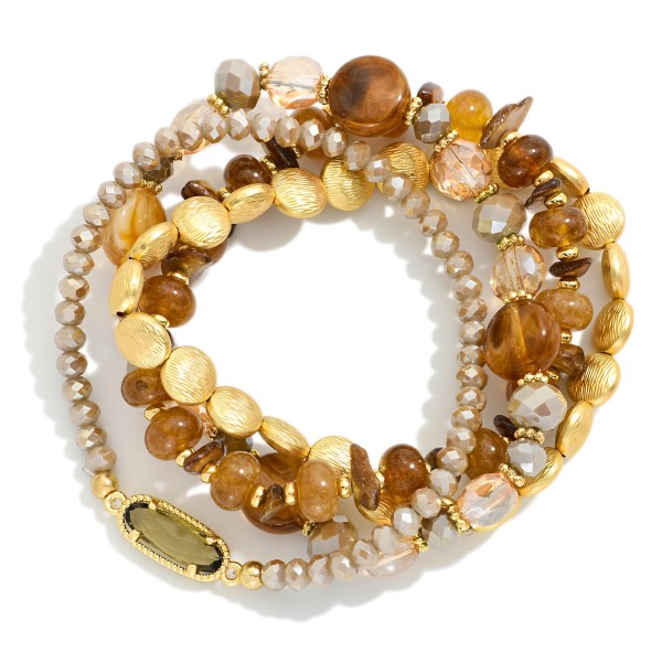 Set Of Four Beaded Stretch Bracelets Featuring Gold Tones, Stone, & Glass Crystal 

- Approximately 3" D 