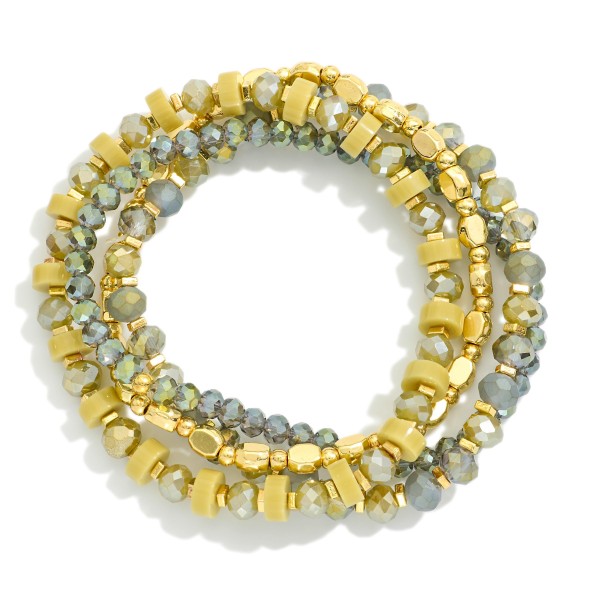 Set Of Four Beaded Stretch Bracelets Featuring Faceted Beads, Disks, & Metal Tones

- Approximately 3.25" D