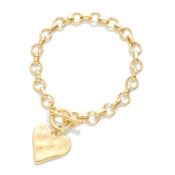 Metal Tone Chain Link Bracelet Featuring Toggle Clasp & Heart Charm 

- Approximately 4" D 