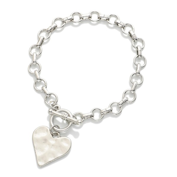 Metal Tone Chain Link Bracelet Featuring Toggle Clasp & Heart Charm 

- Approximately 4" D 