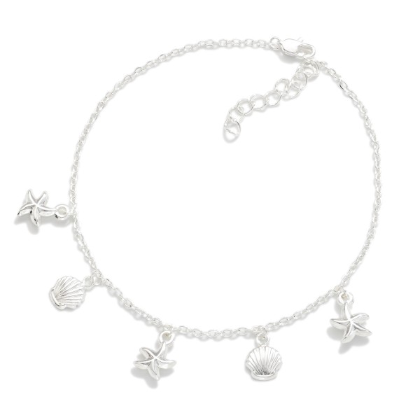 Chain Link Anklet Featuring Metal Starfish & Shell Charms 

- Approximately 4" D
- Extender 3" L
- Stainless Steel
- Water Resistant
- Hypoallergenic