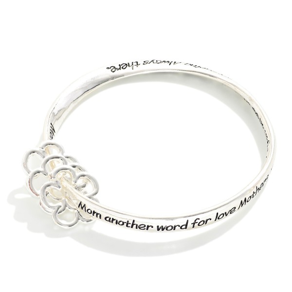 "Mom" Engraved Metal Tone Bangle Bracelet Featuring Flower Accents

- Approximately 2.5" D 