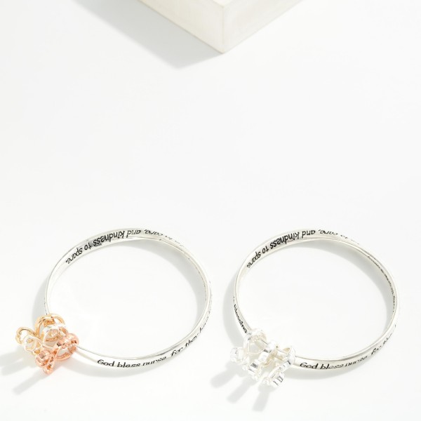 "Nurse's Blessing" Engraved Metal Tone Bangle Bracelet Featuring Stethoscope Accents

- Approximately 2.5" D 