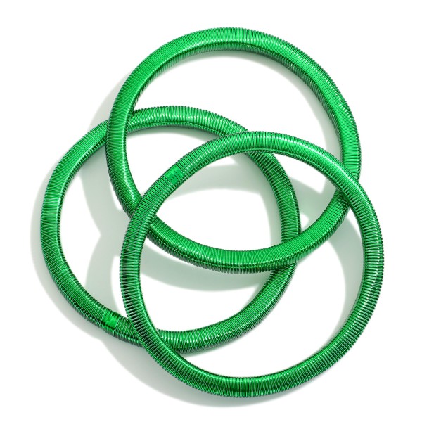 Set Of Three Christmas Metal Spring Stretch Bracelets 

- Approximately 2.25" D