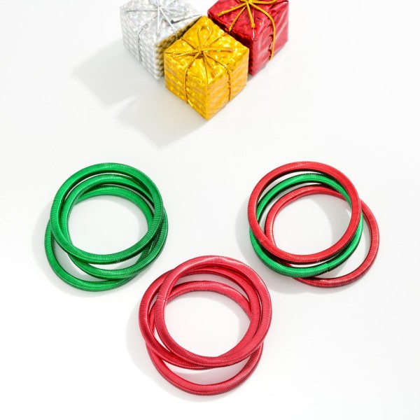 Set Of Three Christmas Metal Spring Stretch Bracelets 

- Approximately 2.25" D
