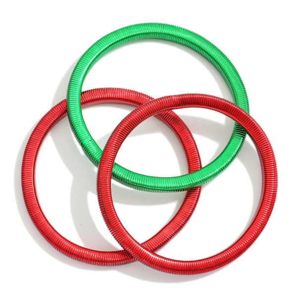 Set Of Three Christmas Metal Spring Stretch Bracelets 

- Approximately 2.25" D