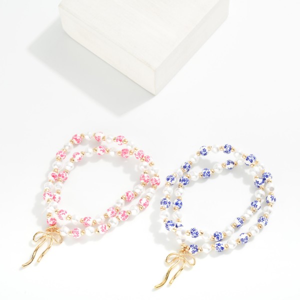 Set Of Two Pearl & Chinoiserie Bead Beaded Stretch Bracelets Featuring Bow Detail 

- Approximately 2.5" D 

