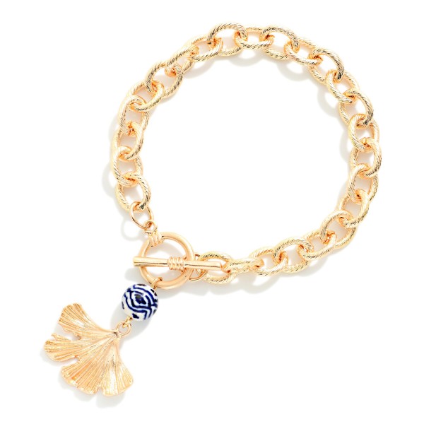 Twisted Metal Chain Link Bracelet With Toggle Clasp Featuring Chinoiserie Bead And Metal Flower Petal Charm

- Approximately 3.5" D 