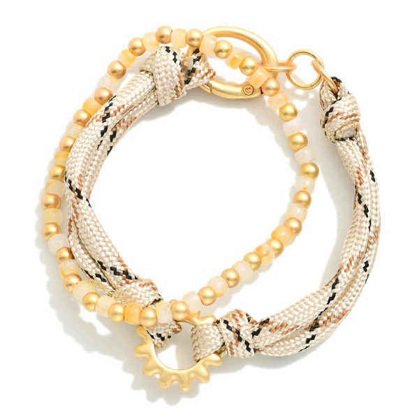 Set Of Two Rope & Bead Bracelets Featuring Metal Tone Sun Detail 

- Approximately 2.75" D