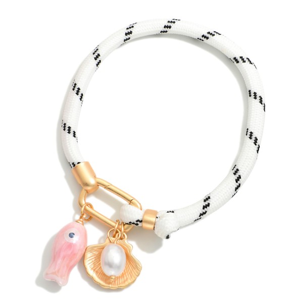 Rope Bracelet Featuring Ceramic Fish & Metal Tone Shell Charms

- Approximately 3" D 